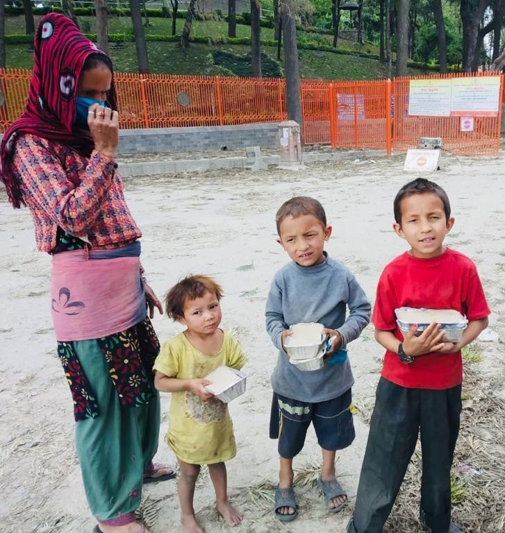 Family with food parcels, Kathmandu